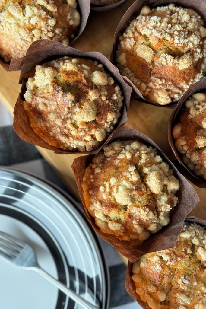 Lemon Poppy Seed Muffins with streusel on a wooden board