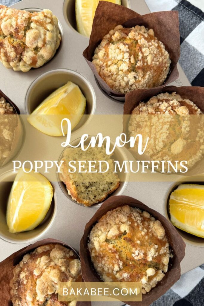 Lemon poppy seed muffins and lemon wedges in a muffin pan 