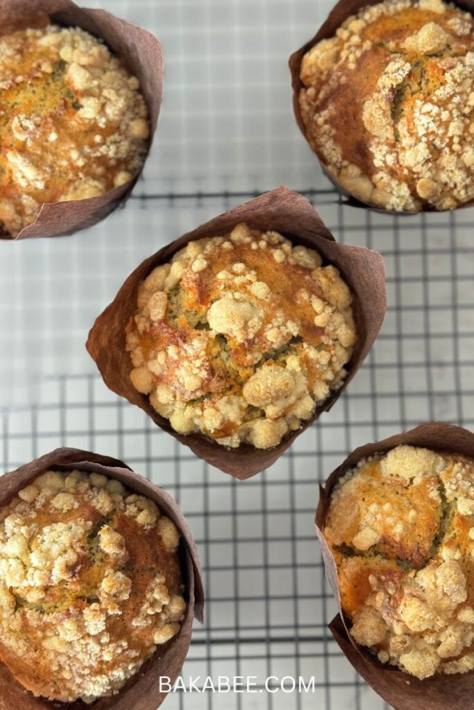 Lemon Poppy Seed Muffins with streusel on a wire rack