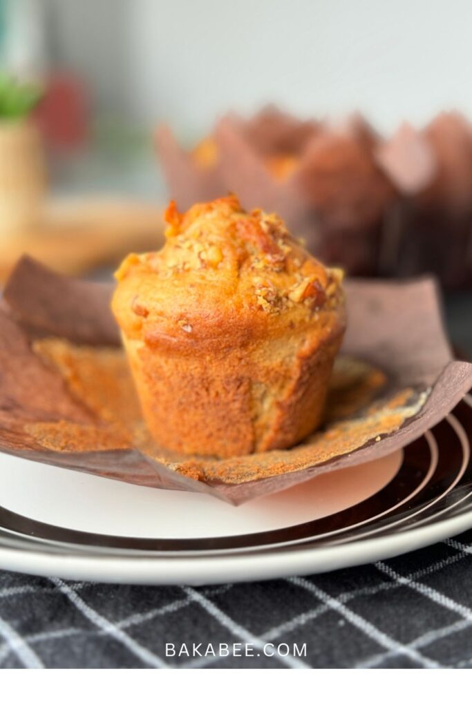 The beat bakery-style banana nut muffin is served on a plate