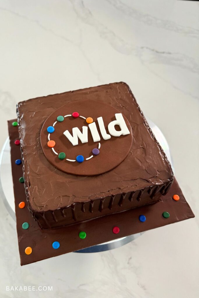 chocolate pound cake with chocolate mascarpone frosting with a fondant customised logo