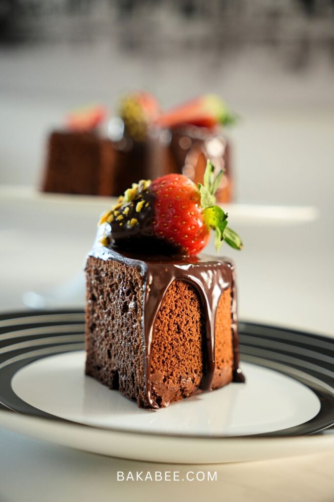 a slice of chocolate chiffon cake with a strawberry